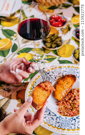 bruschetta with tomato and basil from and wine glass 113922778