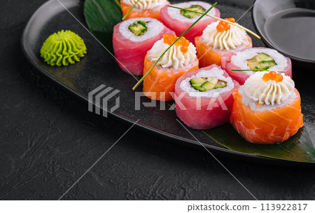 sushi rolls wrapped with salmon and tuna sushi rolls wrapped with salmon and tuna 113922817