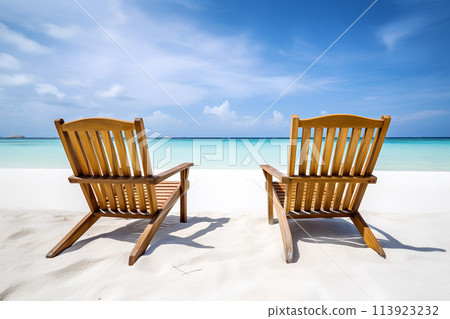 Serene Beach Scene With Two Wooden Chairs on White Sand 113923232