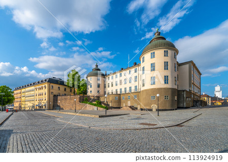 Wrangel Palace, the distinguished seat of the Svea Court of Appeal, basks in the sunlight, showcasing its grand architecture against a clear blue sky on Riddarholmen, Stockholm, Sweden 113924919