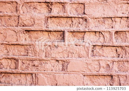 Closeup of a symmetrical pattern of brown brickwork rectangles Closeup of a symmetrical pattern of brown brickwork rectangles 113925703