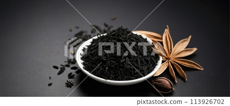Black cumin on a black background. Black cumin on a black background. 113926702