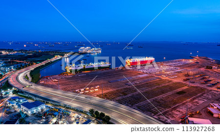 Vehicle carrier ship moored at container terminal at night Vehicle carrier ship moored at container terminal at night 113927268