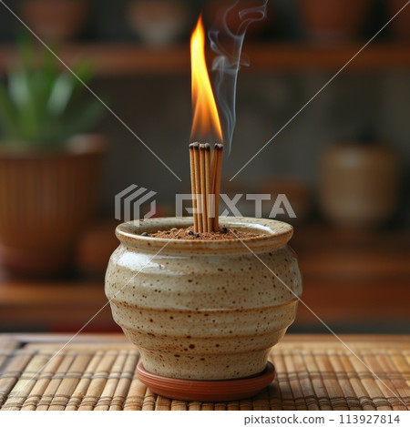 lit incense stick relaxed atmosphere 113927814