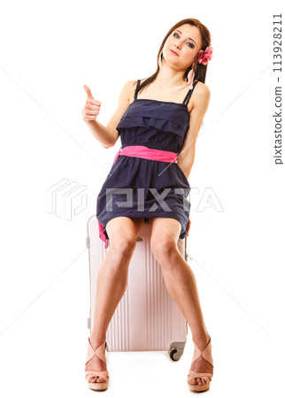 Travel and vacation. Woman with suitcase luggage bag. 113928211