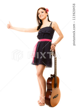 girl with guitar thumbing and hitch hiking isolated 113928458