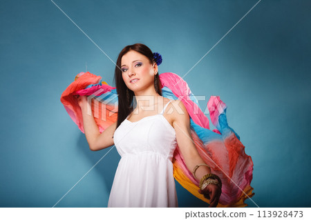 summer woman with colored shawl on blue 113928473