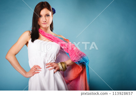 summer woman with colored shawl on blue 113928657