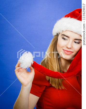 Positive woman wearing Santa Claus helper costume 113929017