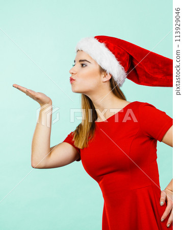 Woman christmas costume sending kisses 113929046