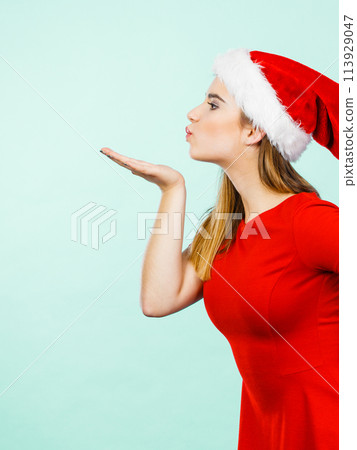Woman christmas costume sending kisses 113929047