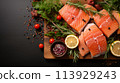 raw salmon fillet on black slate 113929243