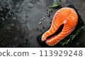 fresh salmon fillet on black slate 113929248