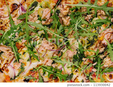 Pizza with tuna, olives and fresh arugula Pizza with tuna, olives and fresh arugula 113930042