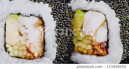 Sushi rolls with salmon, eel, cheese, avocado and black tobiko caviar 113930050