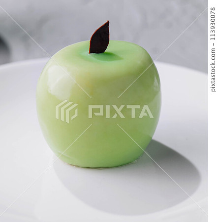 apple shaped mousse cake on plate 113930078