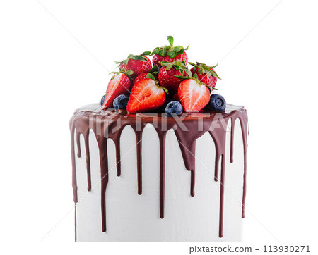 White cake with melted dark chocolate with fresh berries 113930271