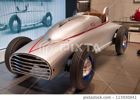 Racing cars on display in the showroom Racing cars on display in the showroom 113930841