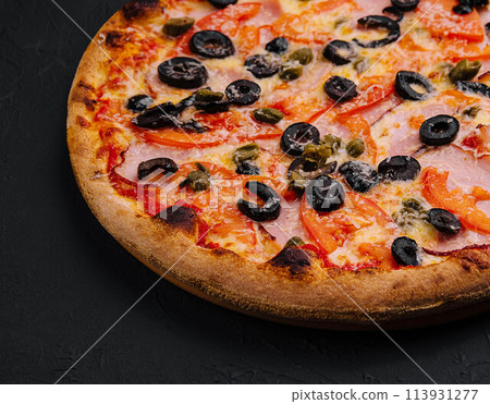 Pizza with ham, parmesan cheese and olives 113931277
