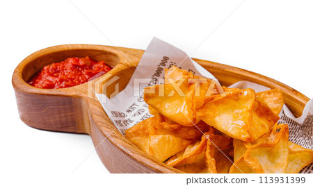 potato crisps with hot sauce isolated 113931399