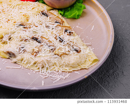 pancakes with mushrooms and parmesan on plate pancakes with mushrooms and parmesan on plate 113931468