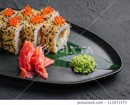 Sushi roll sprinkled with sesame seeds Sushi roll sprinkled with sesame seeds 113931475