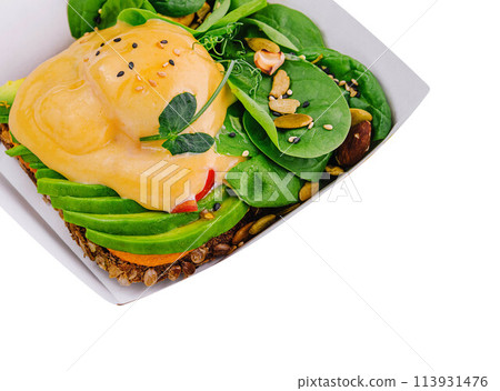 Sandwich with avocado and poached egg Sandwich with avocado and poached egg 113931476