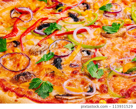 Delicious hot vegetable pizza close up background Delicious hot vegetable pizza close up background 113931529