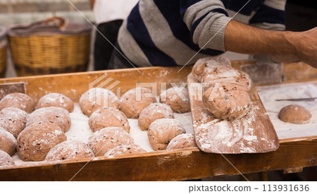 Yeast dough in the form of loaves waiting to be cooked 113931636