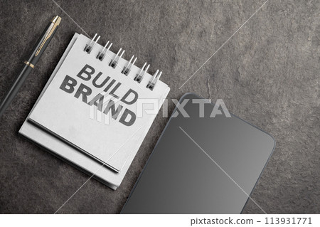 Reminder with build brand text and mobile phone with blank screen for copy space Reminder with build brand text and mobile phone with blank screen for copy space 113931771