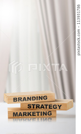 Stack of small wooden blocks with branding strategy marketing text Stack of small wooden blocks with branding strategy marketing text 113931786