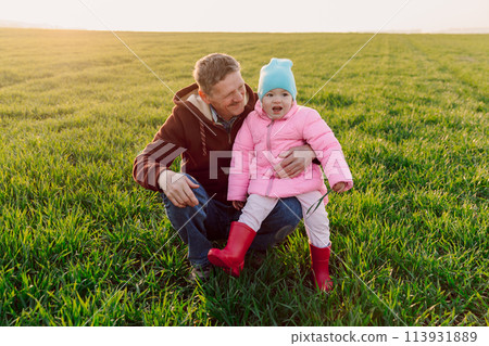 Happy grandfather and granddaughter in the field with sunshine Happy grandfather and granddaughter in the field with sunshine 113931889