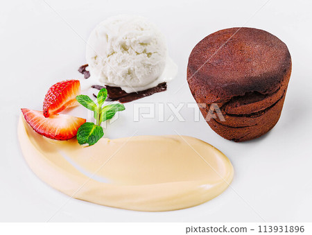 White plate with chocolate fondant cake White plate with chocolate fondant cake 113931896