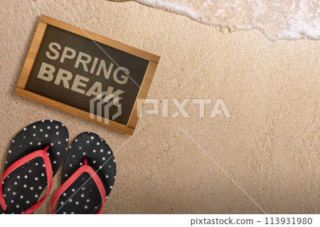 Slipper and small chalkboard with Spring Break text Slipper and small chalkboard with Spring Break text 113931980