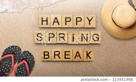 Slipper with beach hat and wooden cubes with Happy Spring Break text Slipper with beach hat and wooden cubes with Happy Spring Break text 113931998