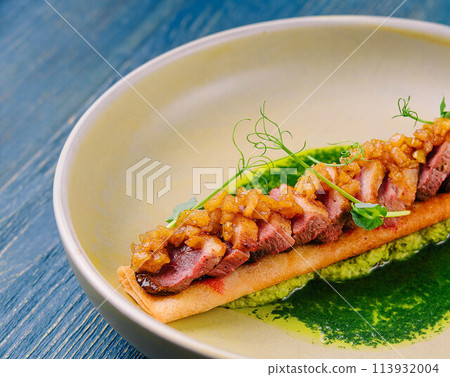 pancake with pesto sauce, ham and onions 113932004