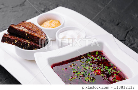 Ukrainian national dish. Borsch on white plate 113932132