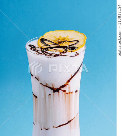 glass cup of milkshake with dry pineapple 113932154