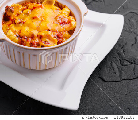 Macaroni and cheese baked on plate Macaroni and cheese baked on plate 113932195