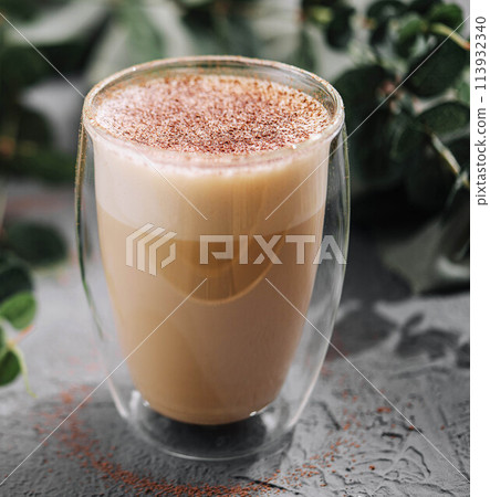 Hot coffee with milk in glass cup Hot coffee with milk in glass cup 113932340