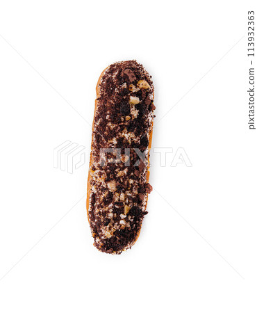 eclair with chocolate and nuts on a white eclair with chocolate and nuts on a white 113932363