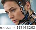 A cyborg woman with an interface headset, focused. She appears immersed in a high-tech task, determination evident. 113933262