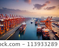 A busy container port operating at dusk. Logistics and global trade. 113933289