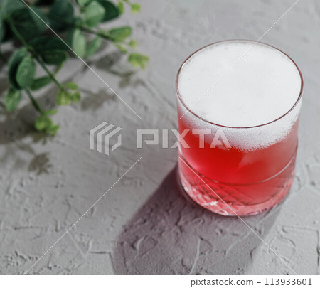 Glass of red soda on top view Glass of red soda on top view 113933601