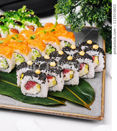 three different types of sushi rolls 113933603
