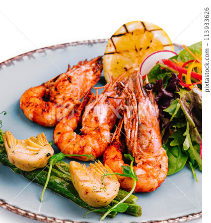 fried shrimp with asparagus and artichokes fried shrimp with asparagus and artichokes 113933626
