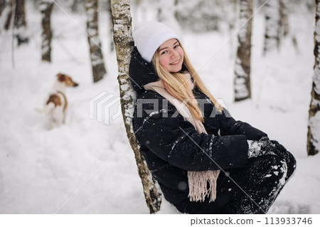 Portrait of a teenage girl in winter in the woods. Portrait of a teenage girl in winter in the woods. 113933746