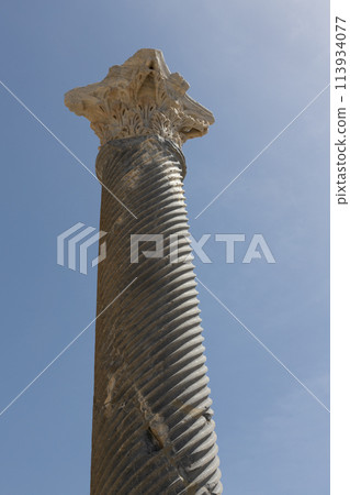 Ancient Corinthian Column Skyward. Close-up of a Corinthian column at the Kourion archaeological site, Cyprus, Ancient Corinthian Column Skyward. Close-up of a Corinthian column at the Kourion archaeological site, Cyprus, 113934077