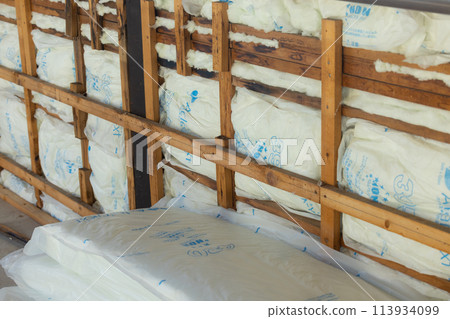 Worker cutting wood 113934099