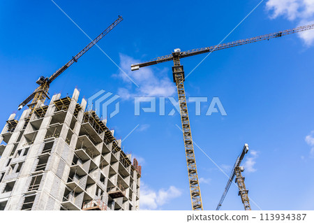 Construction industry building. Construction industry site with cranes, fittings and concrete. 113934387